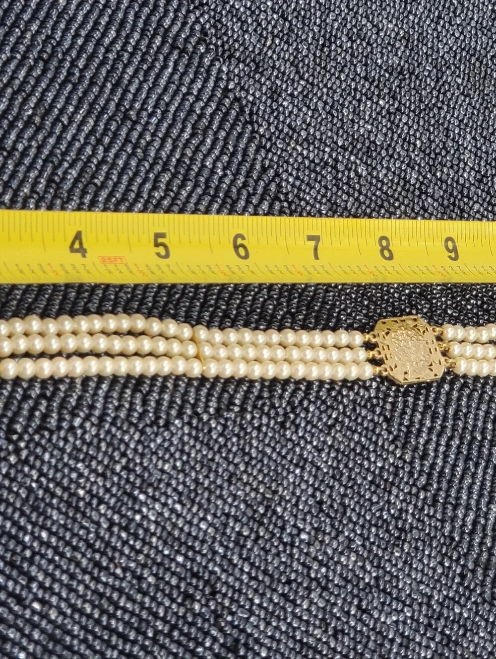 Vintage-style 3-strand pearl choker necklace with a prominent cameo centerpiece